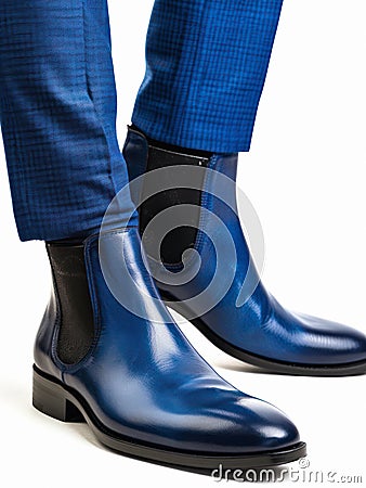 Blue leather chelsea boots on male feet. Stock Photo